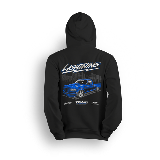 Hoodie featuring a slammed blue Ford Lightning truck over a city skyline with stylized Lightning script and lowered stance.