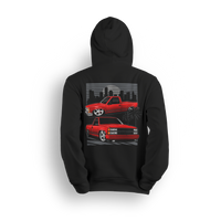 Hoodie with two red OBS trucks, city skyline, palm trees, and low stance. Design captures the sunset cruise truck scene.