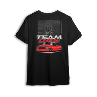 Black OBS Legend t-shirt from TeamOBSOFFICIAL.com featuring red slammed Chevy truck and garage sketch background